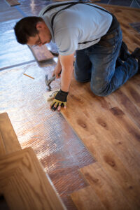 AfterCare Restoration putting in new hardwood flooring